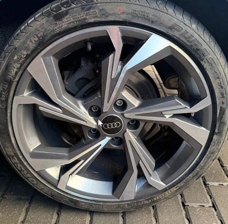 Audi RS alloy wheel after full diamond cut refurbishment — polished face with gunmetal satin valleys