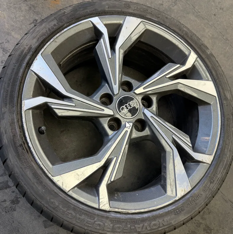 Audi RS multi-spoke alloy wheel before refurbishment — peeling lacquer and oxidation