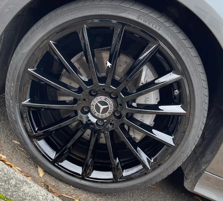 Mercedes multi-spoke alloy wheel after refurbishment — deep gloss black finish