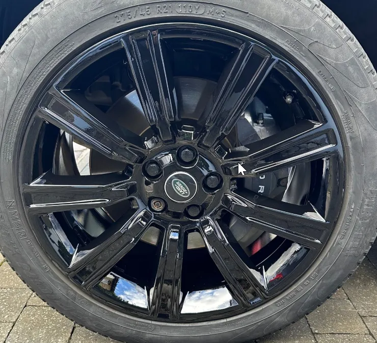 Range Rover split-spoke alloy wheel after full refurbishment — gloss black finish